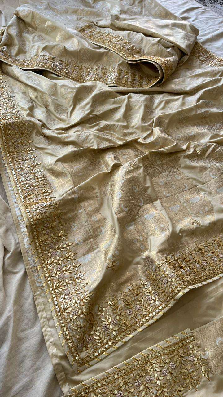Golden & silver pure katan silk saree with intricate gotapatti, zarodozi & pearl work. Includes a pure katan silk banarasi blouse.